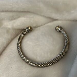 Bracelet, silver tone bangle opening on one side and are sparkly little heavy